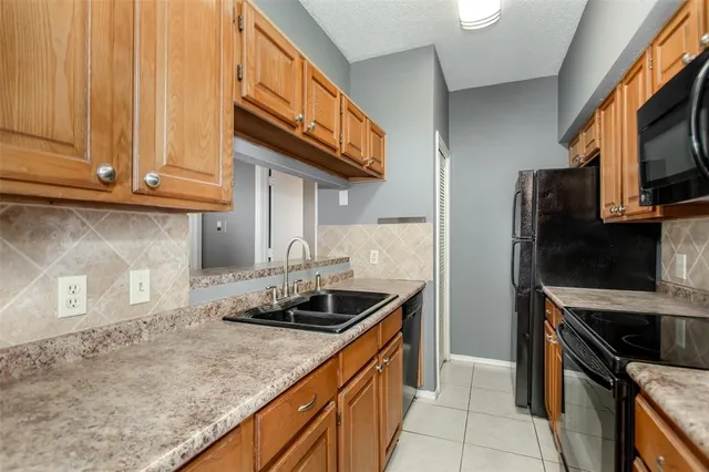 a view of a backyard with sitting area