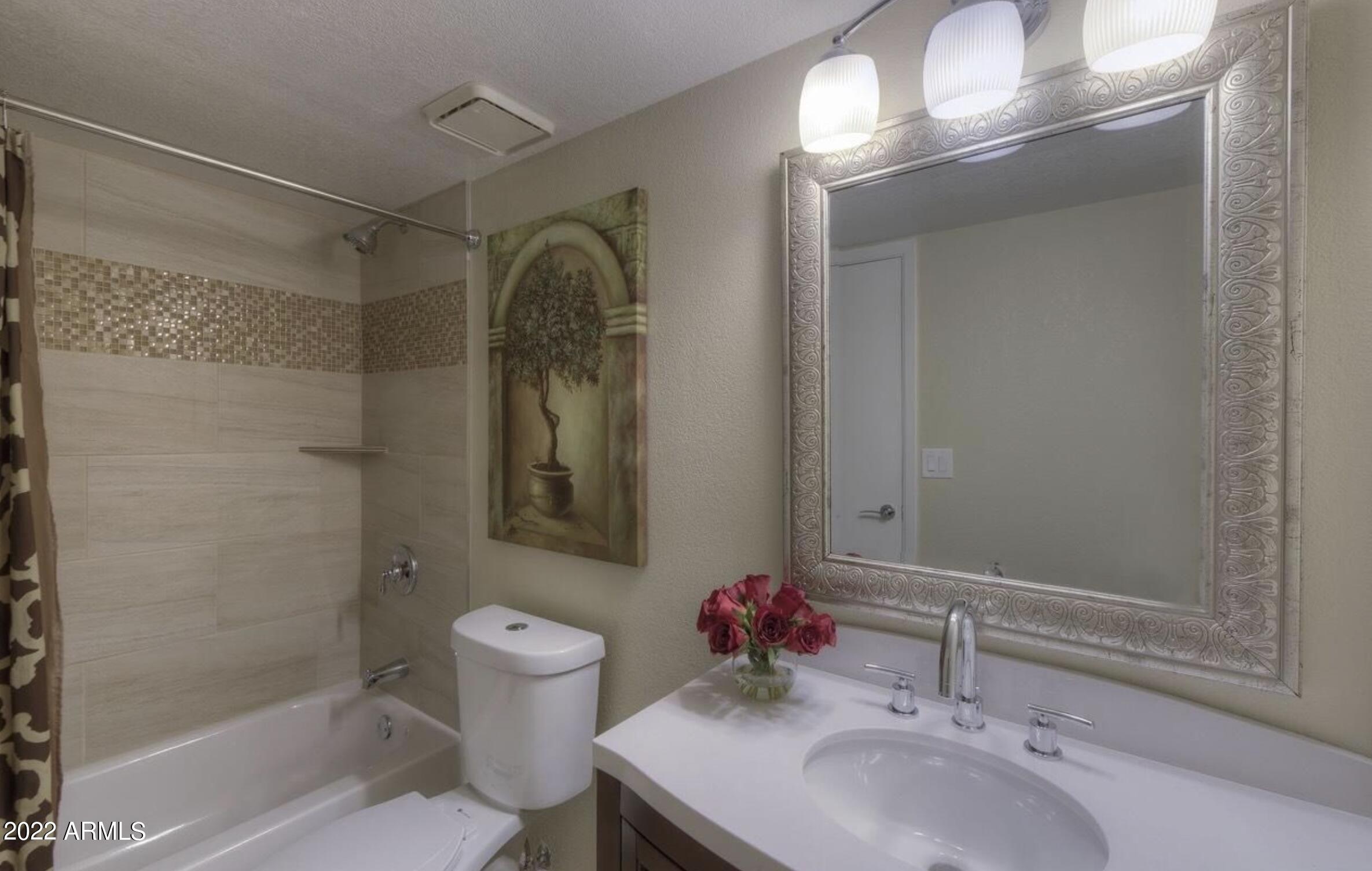 6609 East Phelps Road Scottsdale, AZ 85254 - Photo 59 of 83 a bathroom with a sink toilet and shower