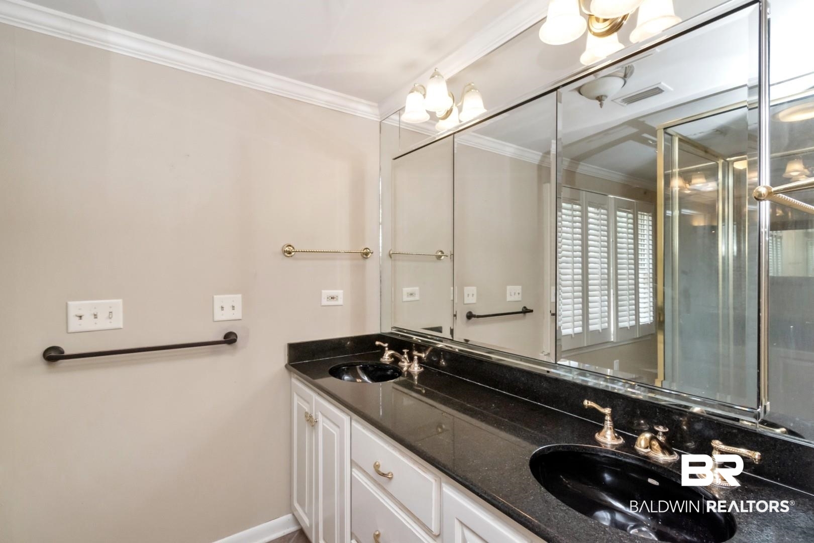 3755 Claridge Road North Mobile, AL 36608 - Photo 23 of 38 Bathroom featuring double vanity, ornamental molding, and baseboards