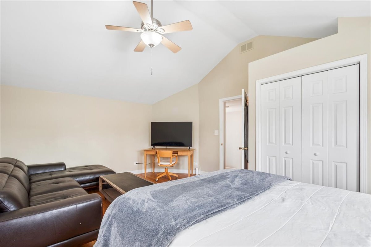 291 Lionel Road Riverside, IL 60546 - Photo 20 of 32 a bedroom with a bed and a television