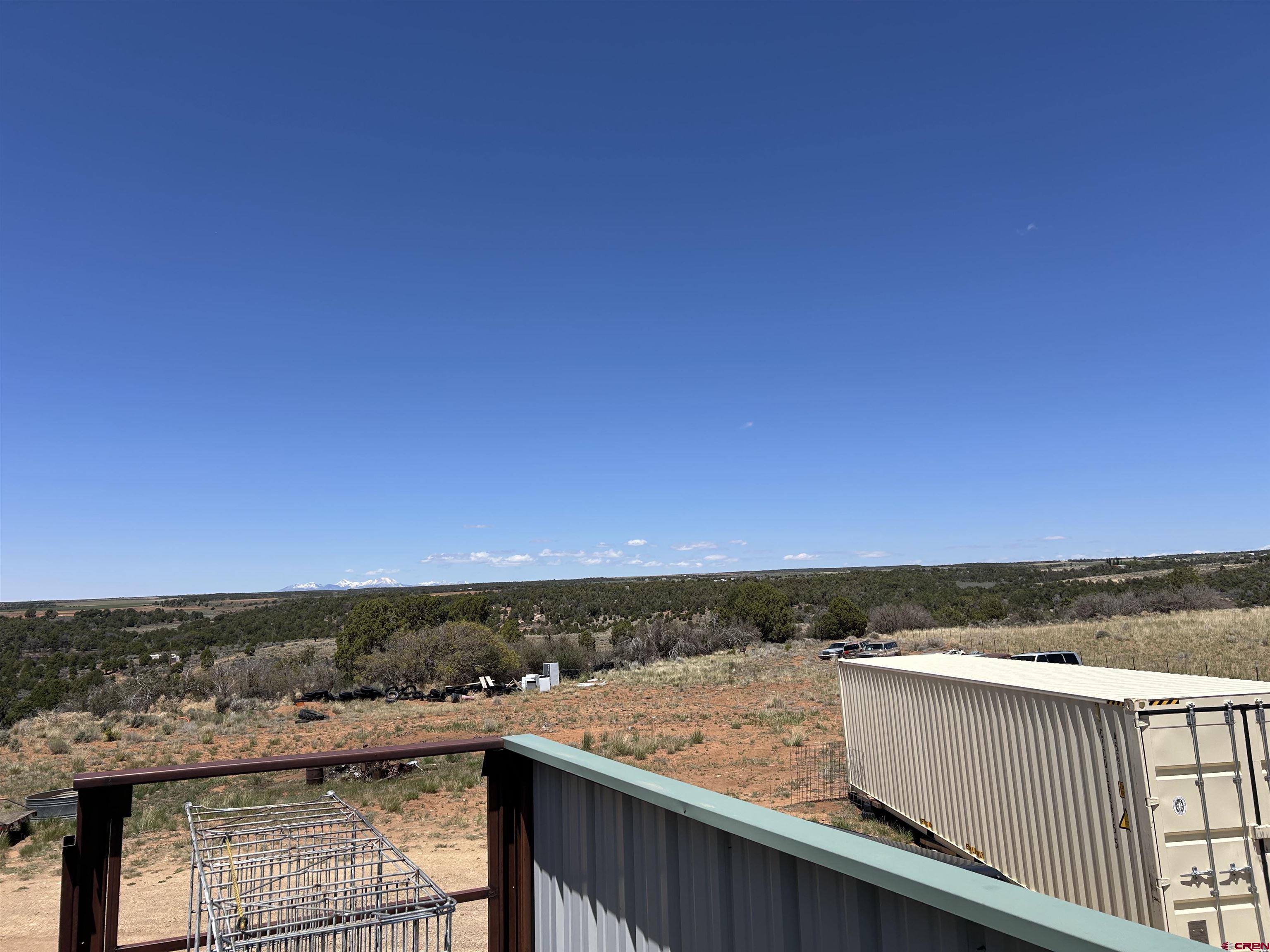 2011 County Road F4 Egnar, CO 81325 - Photo 17 of 34 a view of an ocean from a balcony