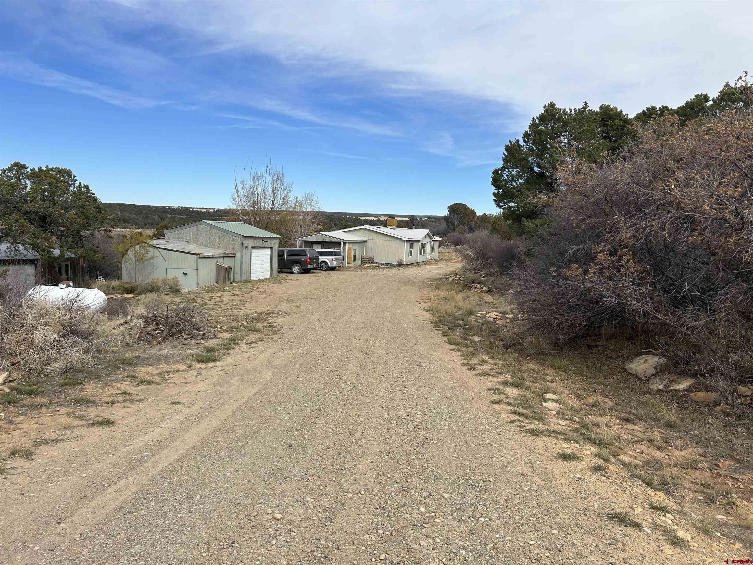 2011 County Road F4 Egnar, CO 81325 - Photo 24 of 34 a view of a dry yard with wooden fence