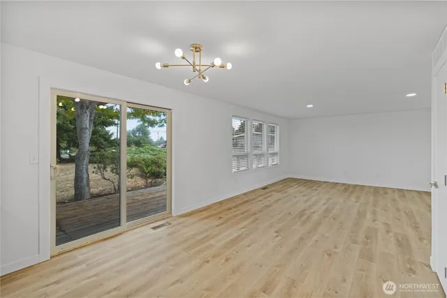 a kitchen with stainless steel appliances granite countertop a refrigerator and a stove