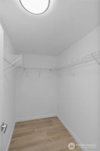 a bathroom with a double vanity sink mirror and shower