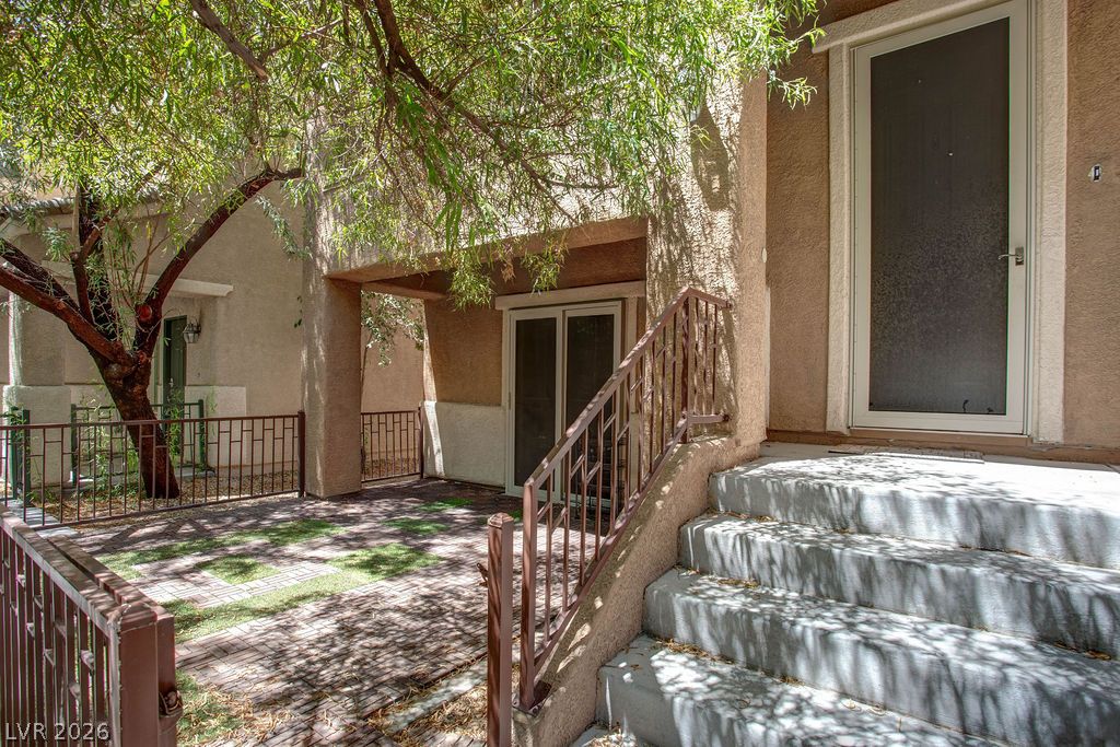 7724 Vibrant Thread Court Las Vegas, NV 89149 - Photo 37 of 43 Concrete steps lead to a welcoming entry with shaded patio space, perfect for outdoor enjoyment.