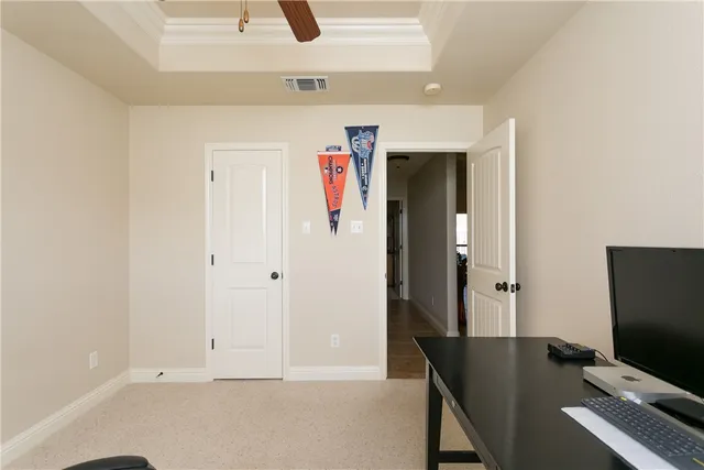 a bathroom with a granite countertop sink a toilet and a mirror