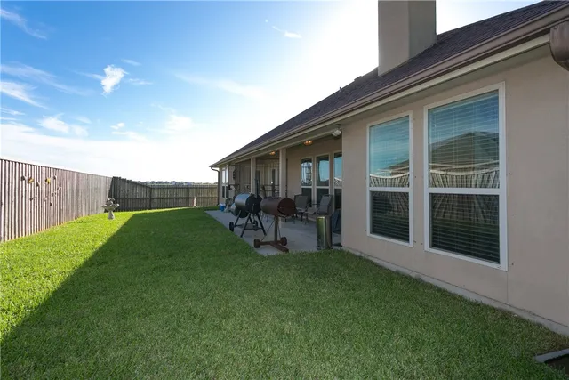 a backyard of a house with lots of green space
