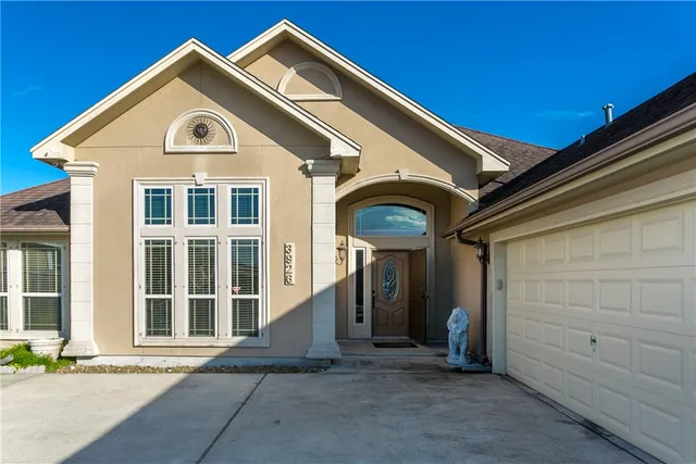 a front view of a house with a garage