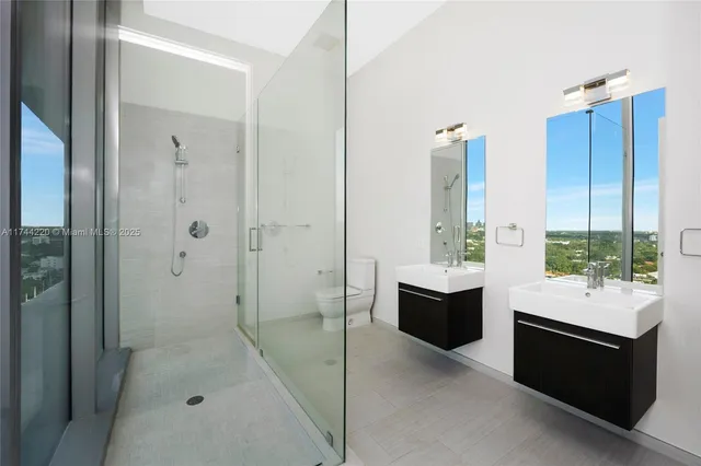 a room with pool table and glass door