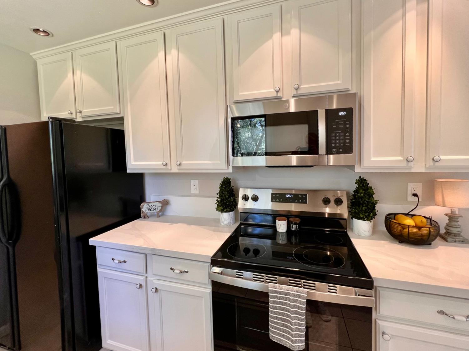 2506 Buffalo Hill Road Georgetown, CA 95634 - Photo 18 of 79 a kitchen with stainless steel appliances white cabinets and a stove