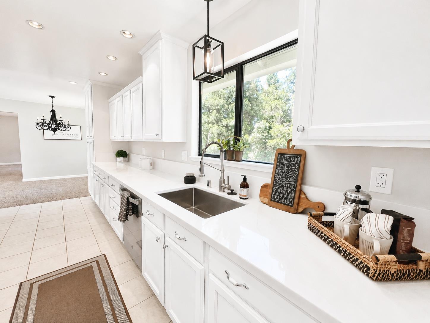 2506 Buffalo Hill Road Georgetown, CA 95634 - Photo 2 of 79 a kitchen that has a lot of white cabinets and wooden floor