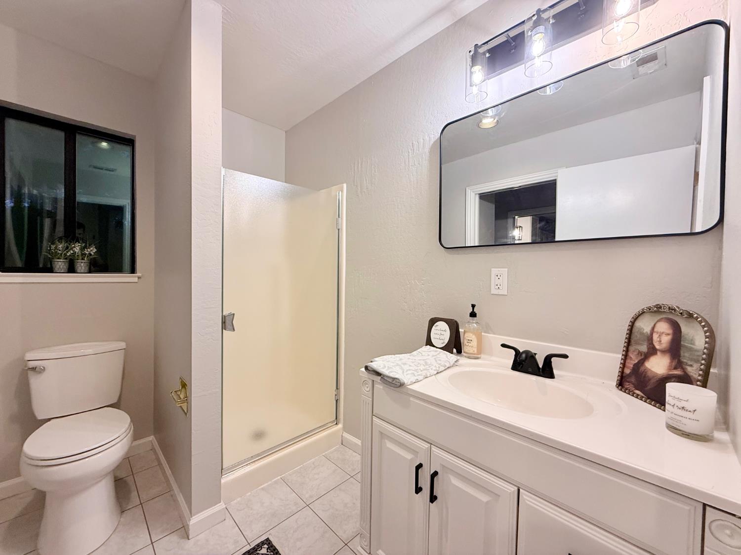 2506 Buffalo Hill Road Georgetown, CA 95634 - Photo 24 of 79 a bathroom with a toilet sink and mirror