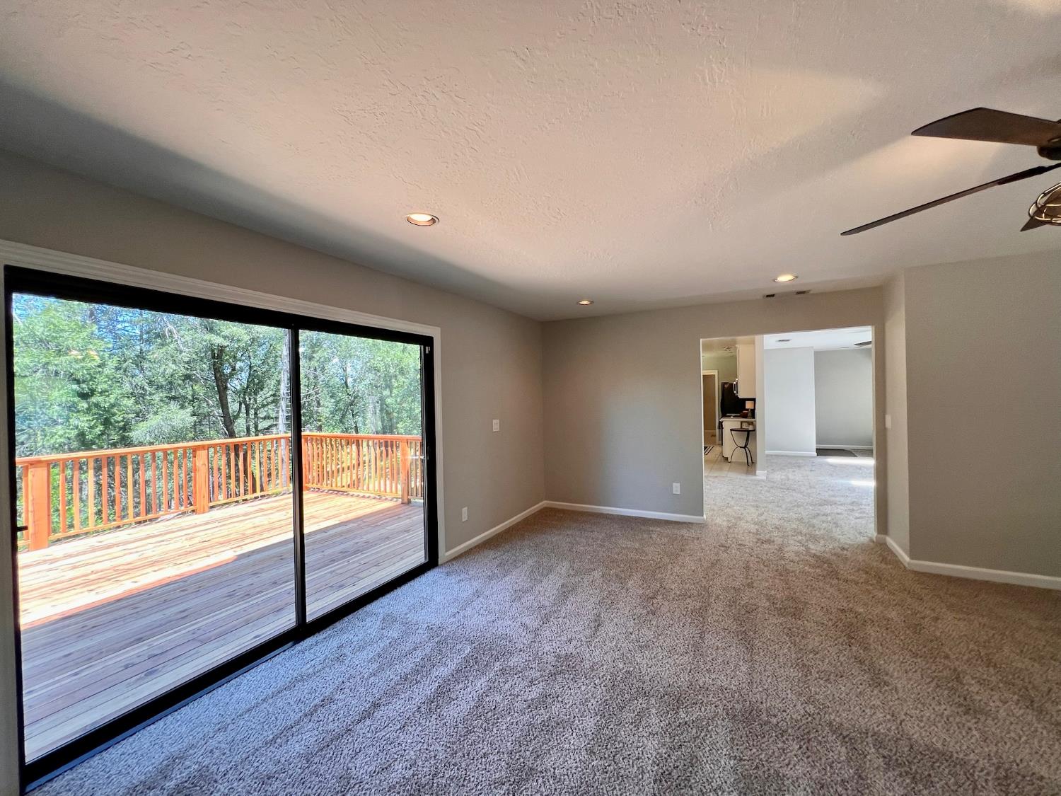2506 Buffalo Hill Road Georgetown, CA 95634 - Photo 38 of 79 a view of an empty room with wooden floor and a window