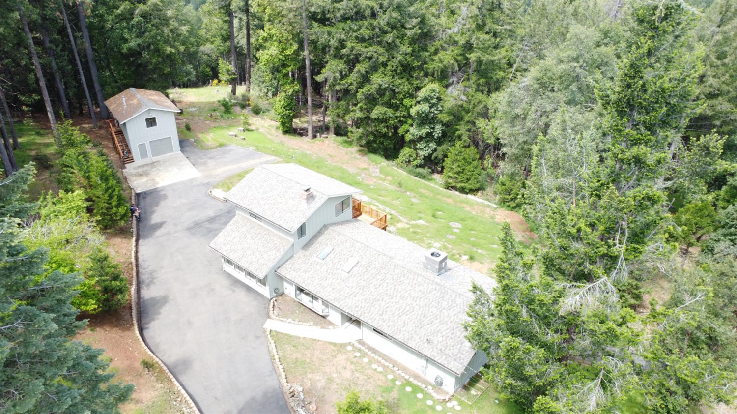 2506 Buffalo Hill Road Georgetown, CA 95634 - Photo 76 of 79 an aerial view of a house with a yard and a large tree