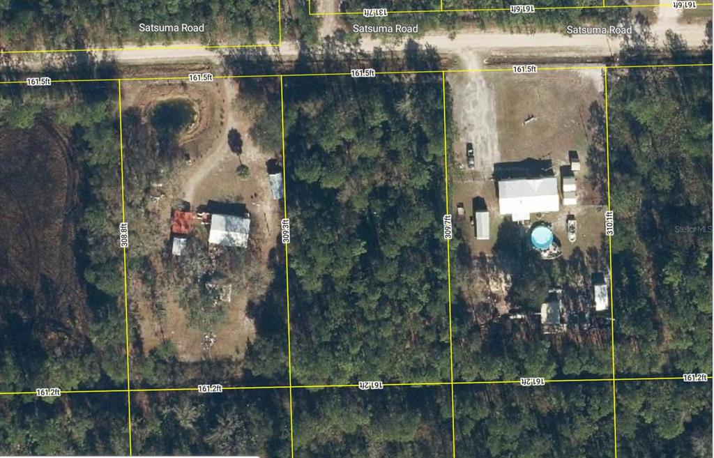 127 East Satsuma Road Palatka, FL 32177 - Photo 2 of 5 a bathroom with a glass shower door and a mirror