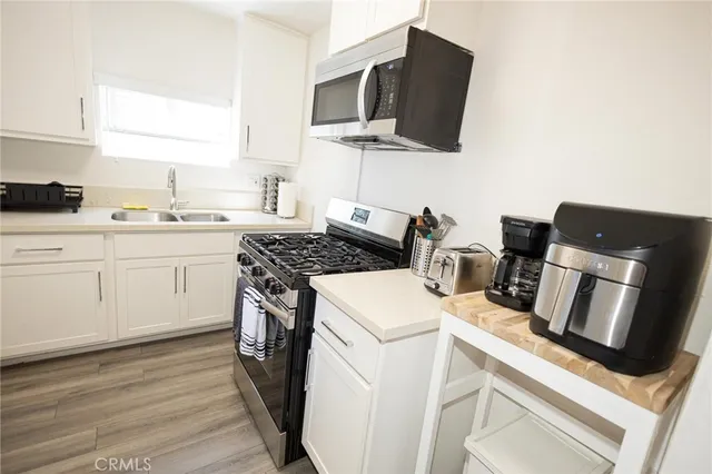 a kitchen with a stove and a microwave
