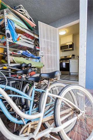a view of a kitchen with a fireplace and a view of a living room