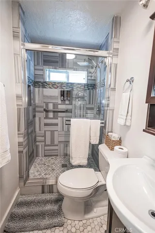 a bathroom with a toilet and shower
