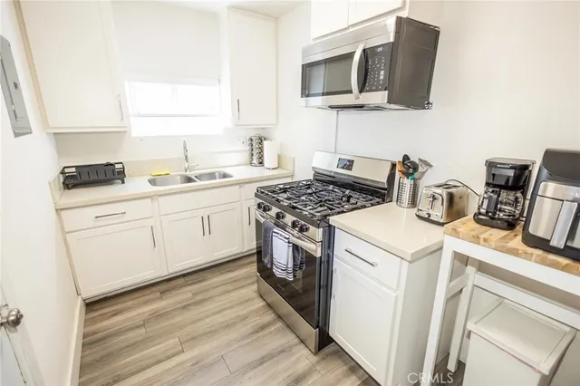 a kitchen with a stove and a microwave