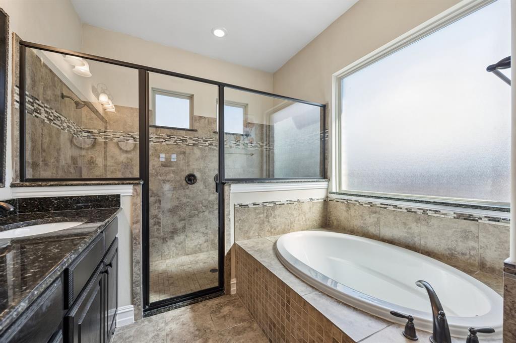 948 Holt Lane Allen, TX 75013 - Photo 17 of 40 Primary bathroom with oversize shower and separate bathtub