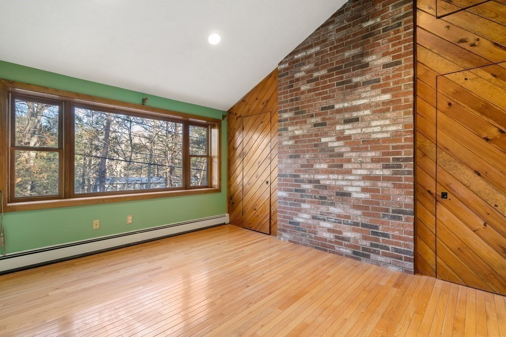 18 St Cloud Avenue Needham, MA 02492 - Photo 13 of 25 a view of a room with a large window and wooden floor