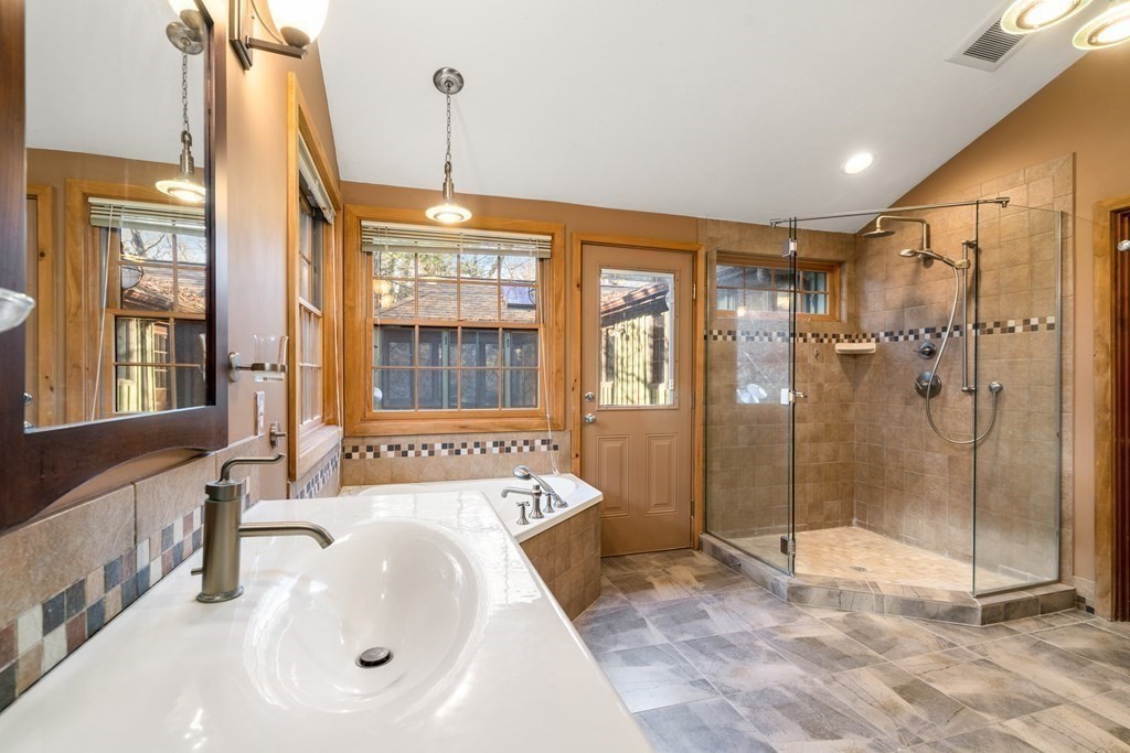18 St Cloud Avenue Needham, MA 02492 - Photo 16 of 25 a spacious bathroom with a tub sink shower and mirror