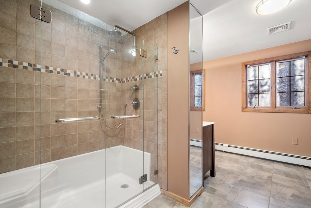 18 St Cloud Avenue Needham, MA 02492 - Photo 17 of 25 a bathroom with a bathtub and a shower