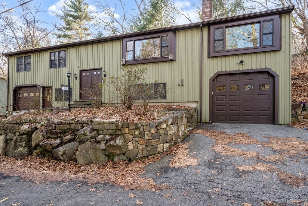 18 St Cloud Avenue Needham, MA 02492 - Photo 2 of 25 a front view of a house with a yard