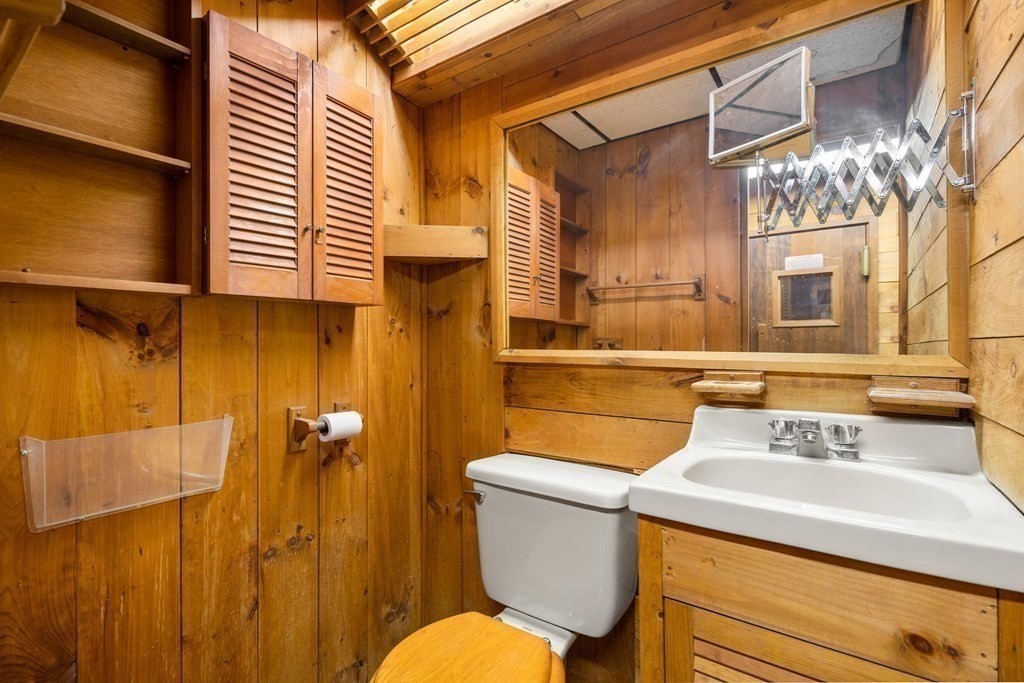 18 St Cloud Avenue Needham, MA 02492 - Photo 24 of 25 a bathroom with a sink a toilet and a mirror