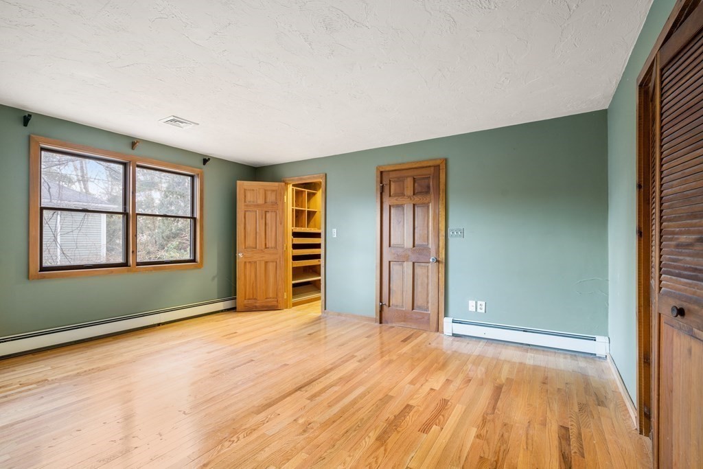 18 St Cloud Avenue Needham, MA 02492 - Photo 10 of 25 an empty room with closet and windows