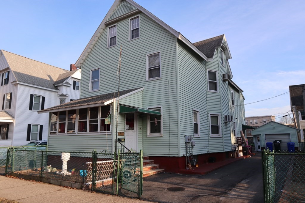 24 Keith Street Springfield, MA 01108 - Photo 5 of 7 a view of a house with a yard