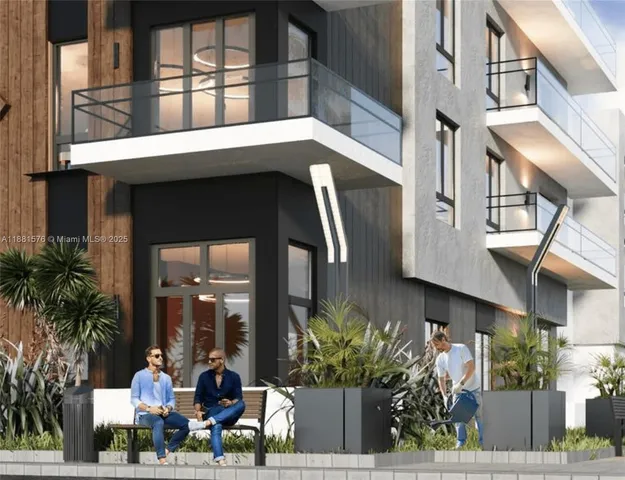 a front view of a building with potted plants