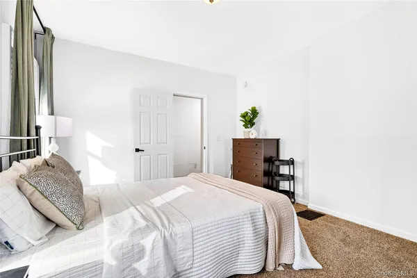 a bathroom with a sink a toilet and a shower curtain