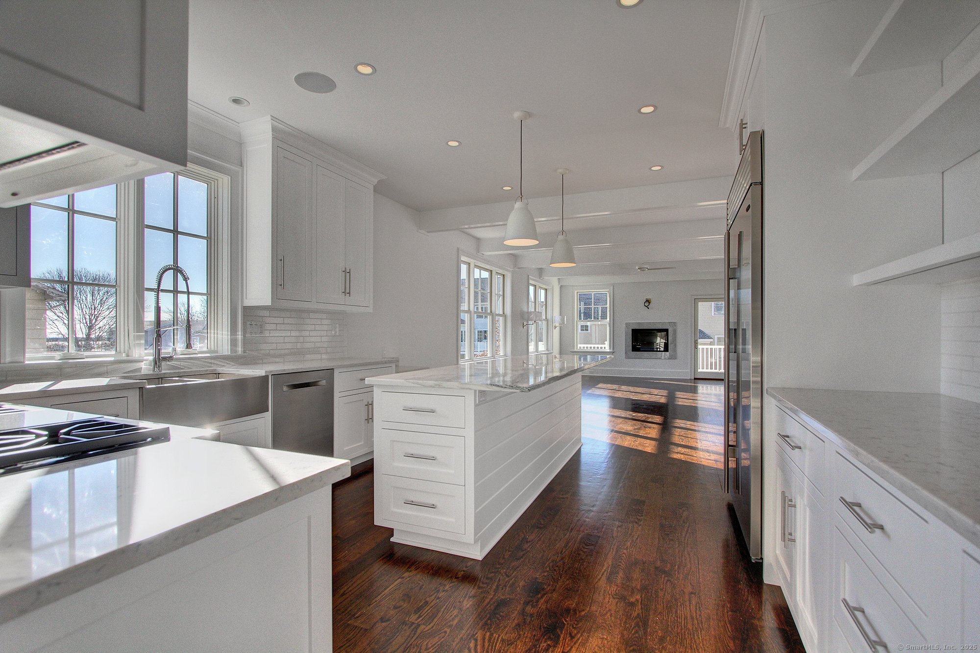 20 Locust Hill Road Darien, CT 06820 - Photo 2 of 12 a kitchen with white cabinets and stainless steel appliances