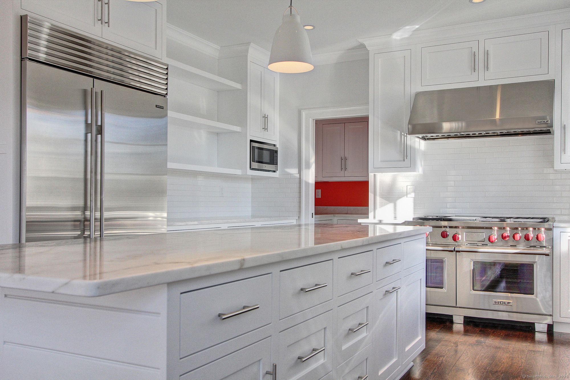 20 Locust Hill Road Darien, CT 06820 - Photo 3 of 12 a kitchen with a refrigerator and a stove