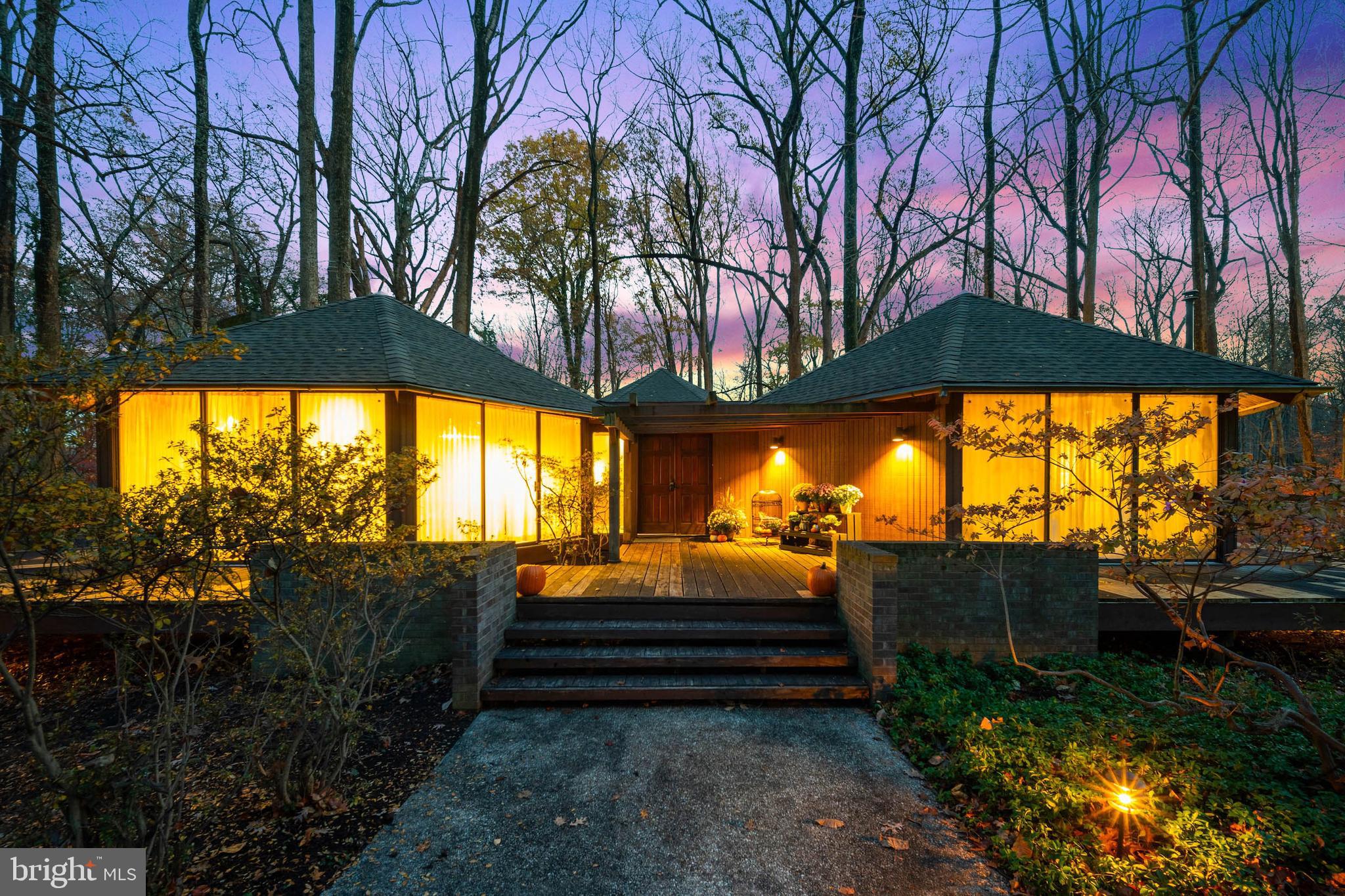 a backyard of a house with barbeque oven table and chairs