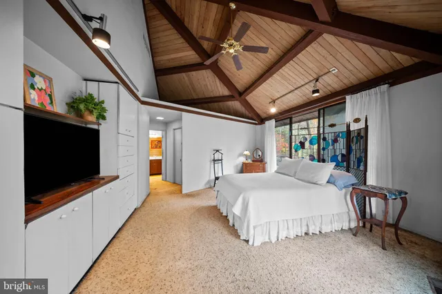 a bathroom with a sink vanity and mirror