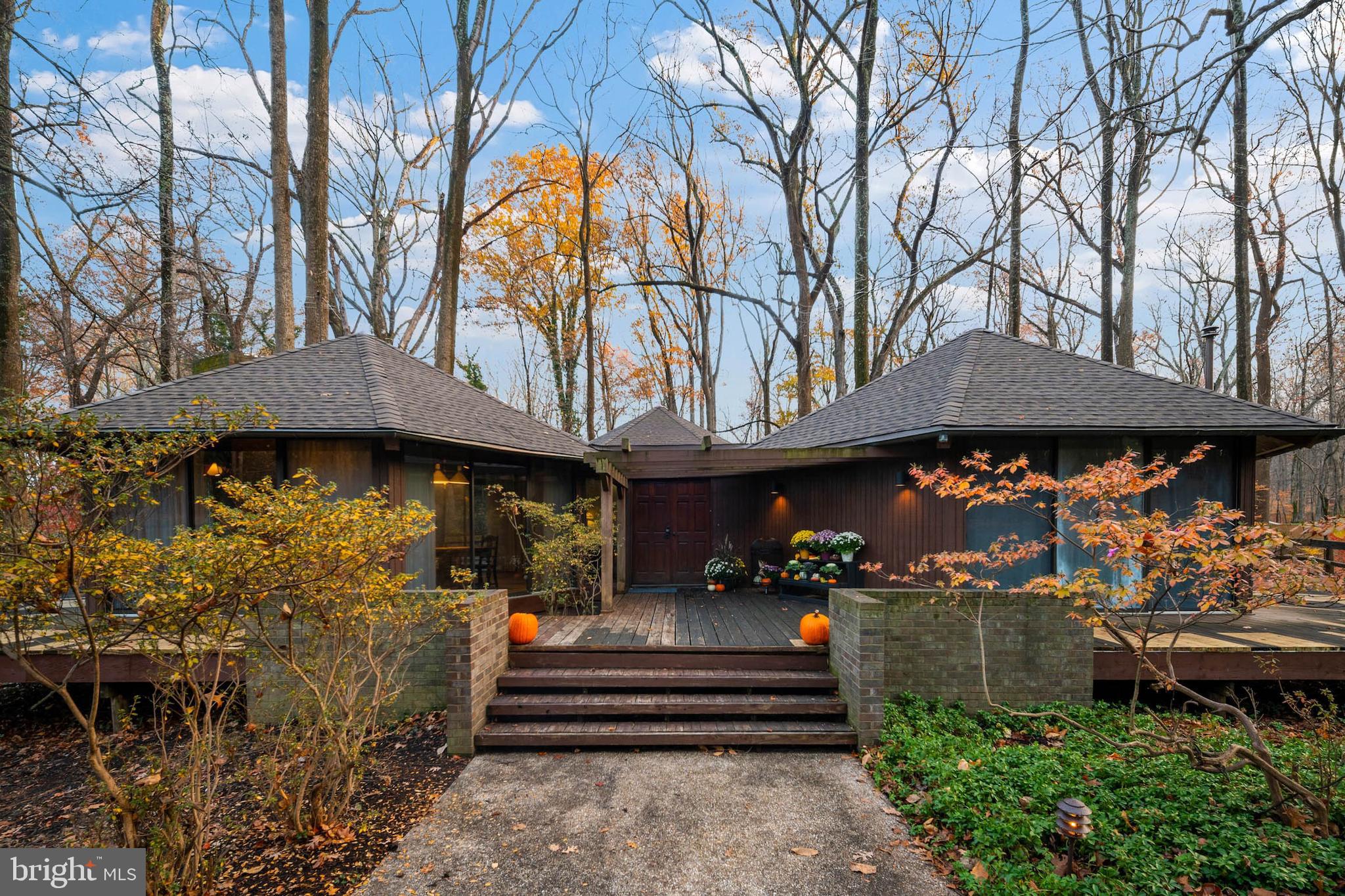2707 Caves Road Owings Mills, MD 21117 - Photo 30 of 30 a view of a chairs and an umbrella in front of house