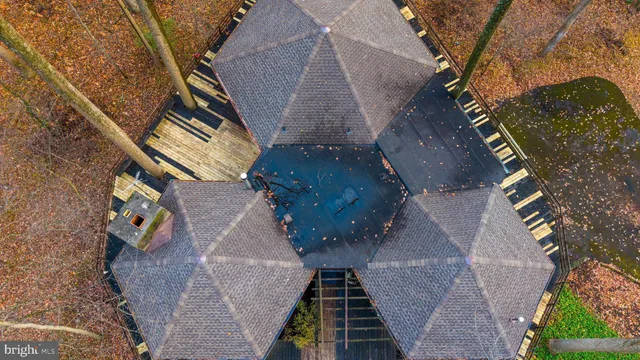 an aerial view of houses with wooden stairs