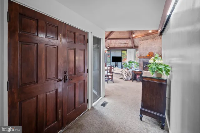 a view of a hallway and dining room