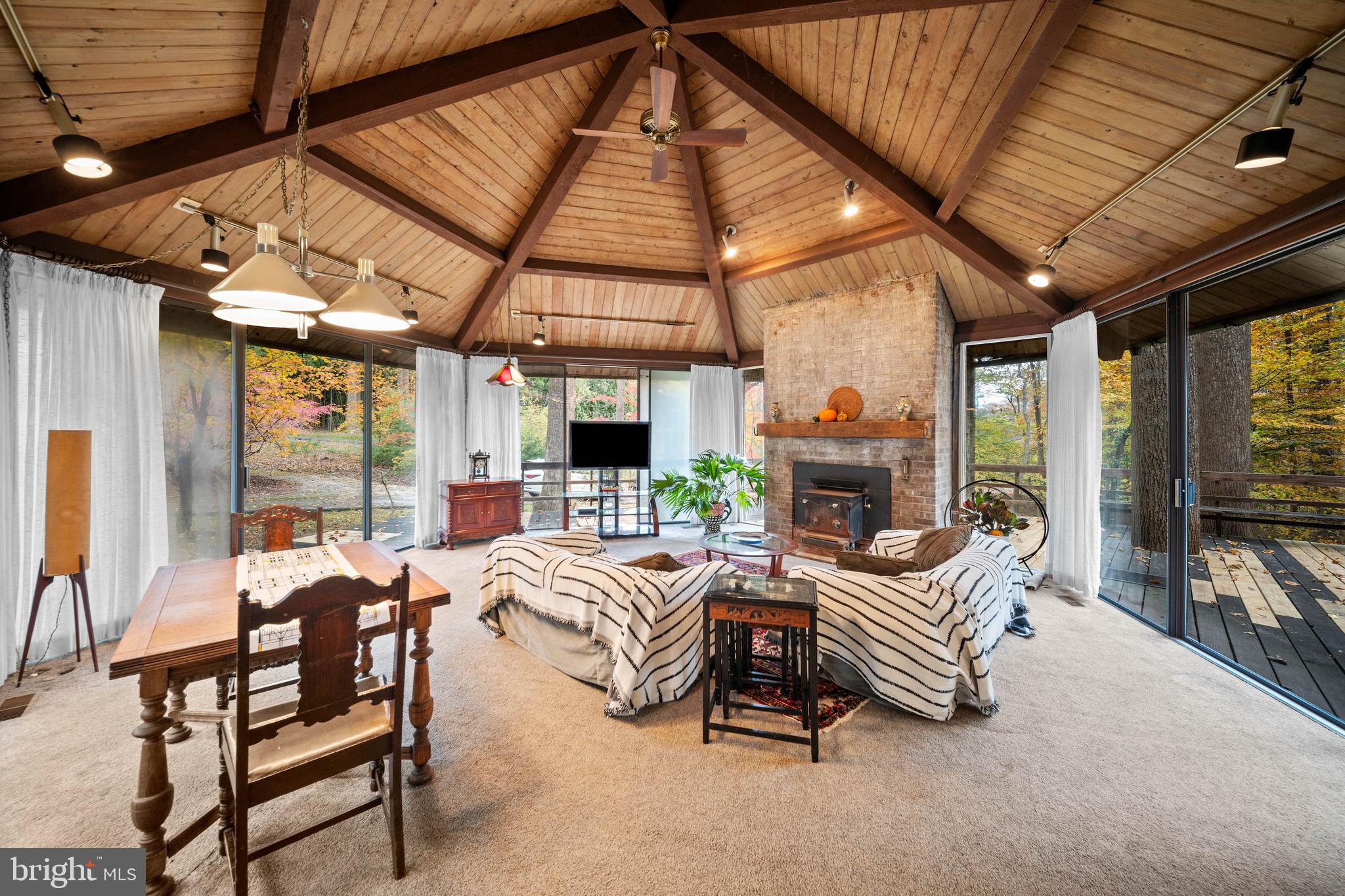 2707 Caves Road Owings Mills, MD 21117 - Photo 8 of 30 a outdoor space with patio furniture and a fireplace