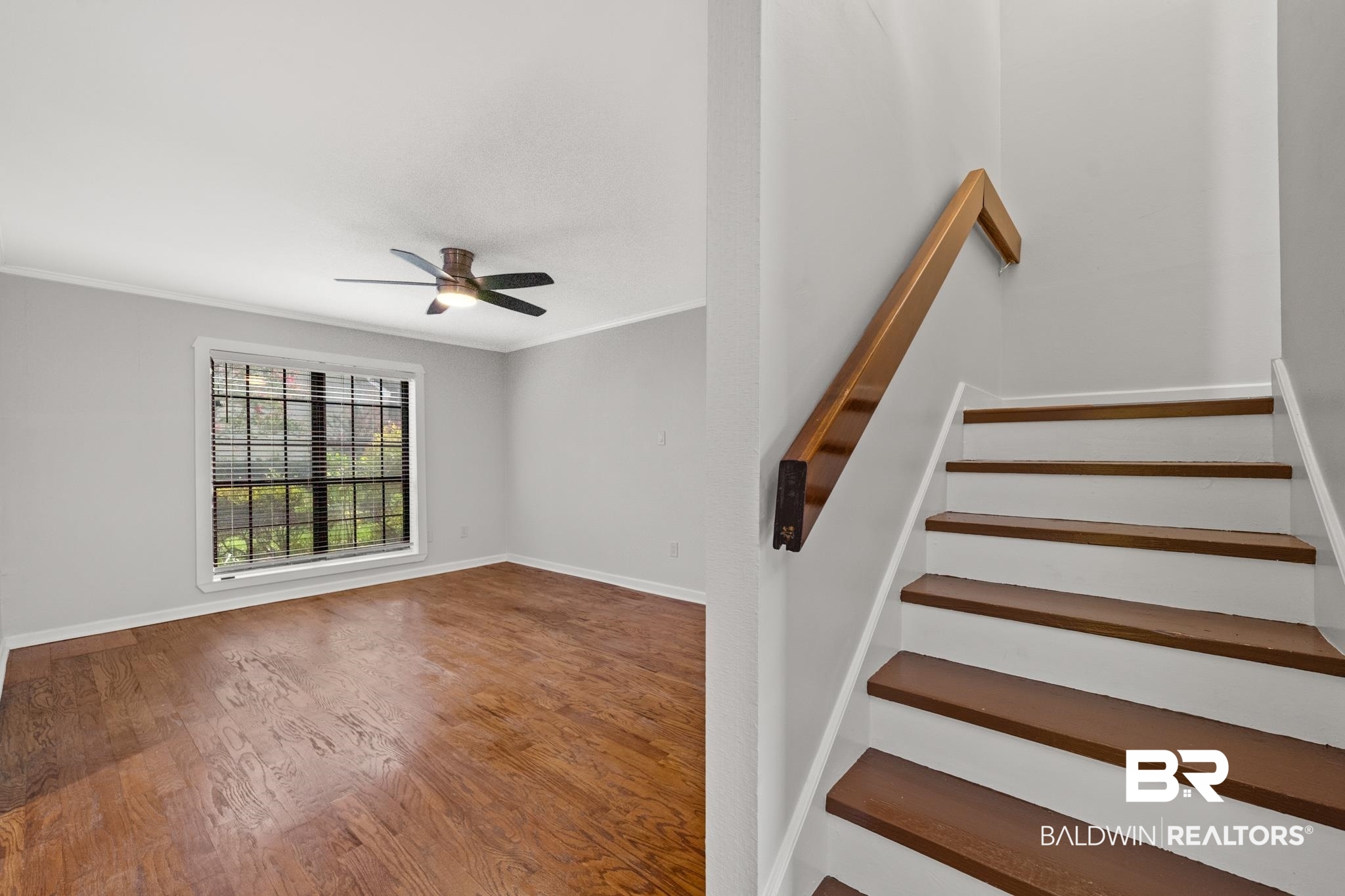 2901 Grant Street, Unit 802 Mobile, AL 36606 - Photo 9 of 37 Stairs featuring ornamental molding, ceiling fan, and hardwood / wood-style floors