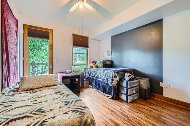 a bedroom with a bed window and a walk in closet