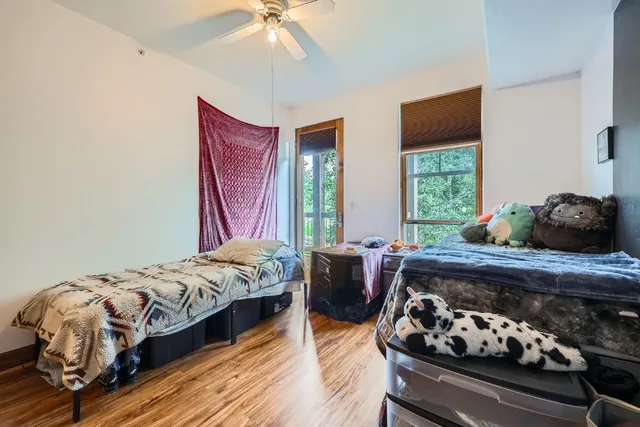 a bedroom with bed and a window