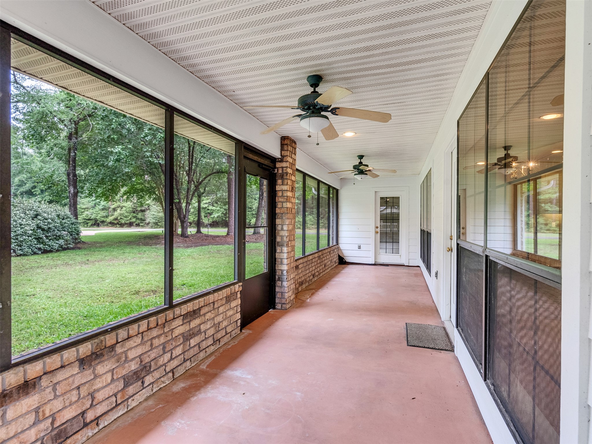 195 Coral Gables Trinity, TX 75862 - Photo 37 of 50 Lovely screened in porch and the primary bedroom has a private entrace.