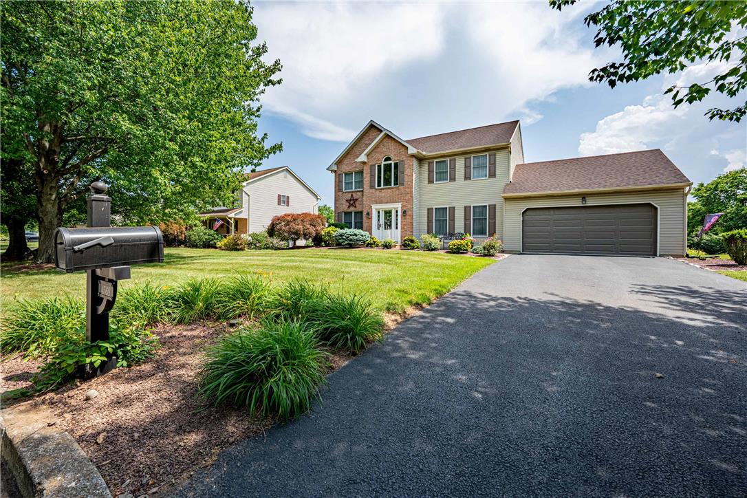 4568 Greenfield Road Bethlehem, PA 18017 - Photo 46 of 59 A classic brick and siding home with an attached garage and a neatly kept lawn.