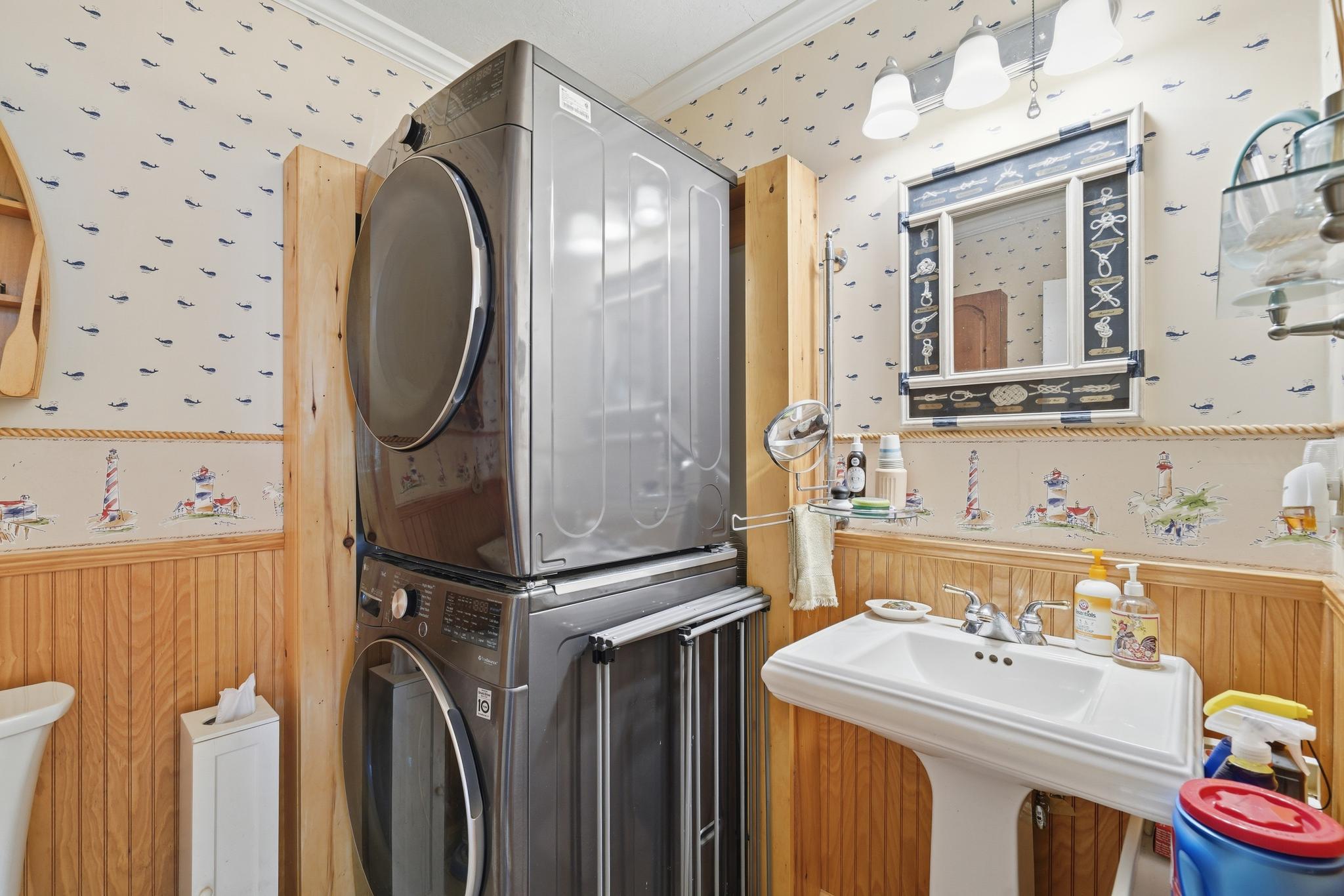 14136 Kentmore Park Road Kennedyville, MD 21645 - Photo 24 of 54 a bathroom with a sink mirror vanity and toilet