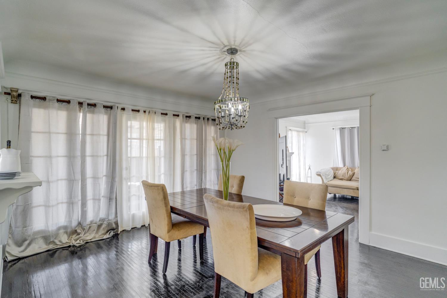 Undisclosed Address Bakersfield, CA 93304 - Photo 12 of 30 a view of a dining room with furniture window and wooden floor