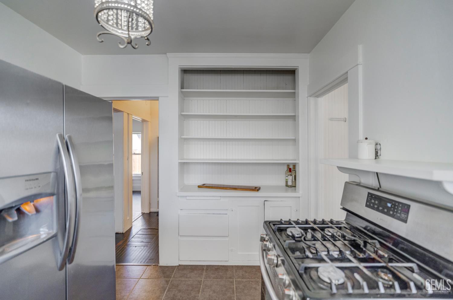 Undisclosed Address Bakersfield, CA 93304 - Photo 18 of 30 a kitchen with a refrigerator and a stove
