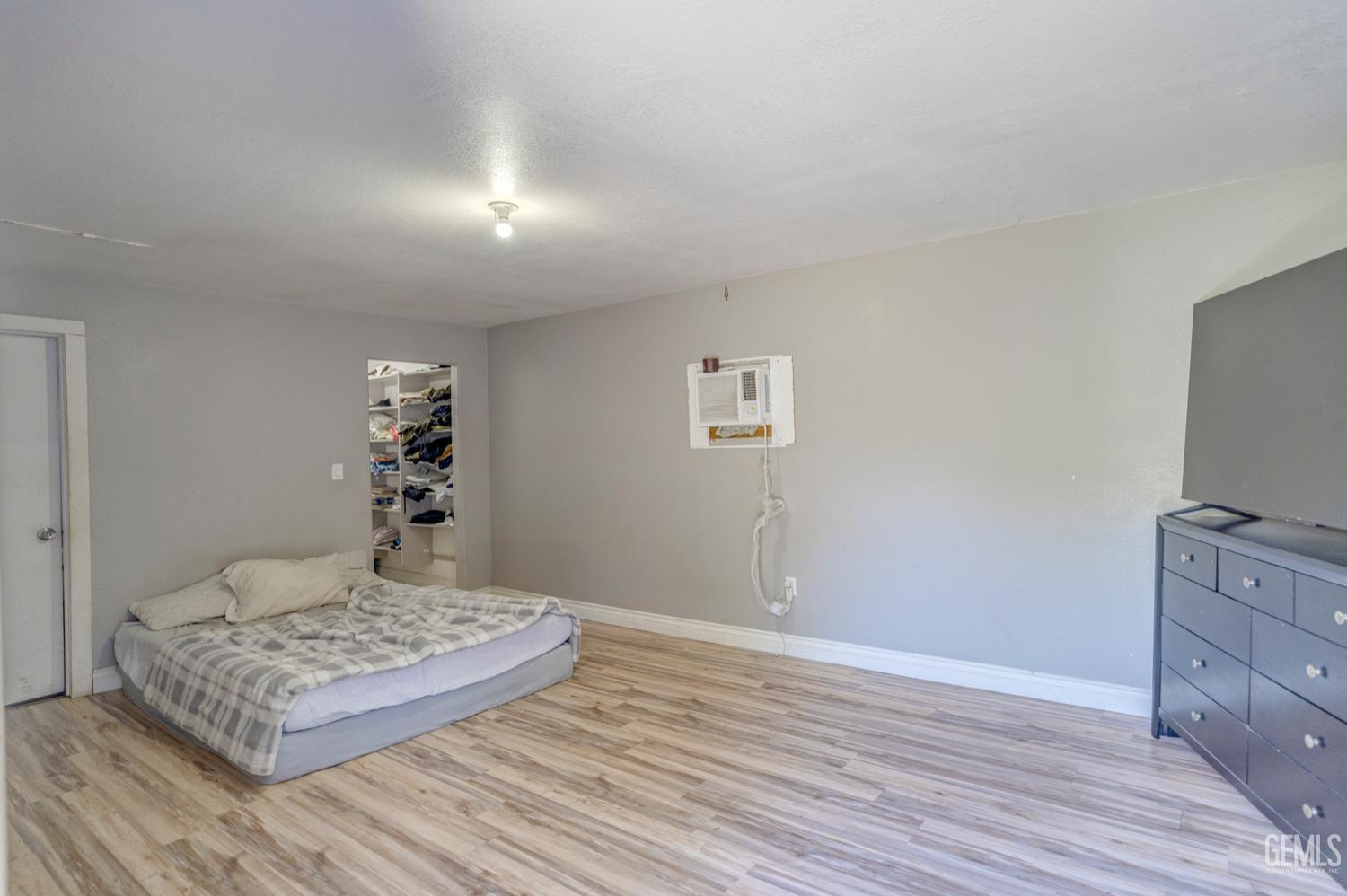 Undisclosed Address Bakersfield, CA 93304 - Photo 24 of 30 a living room with couch and a flat screen tv